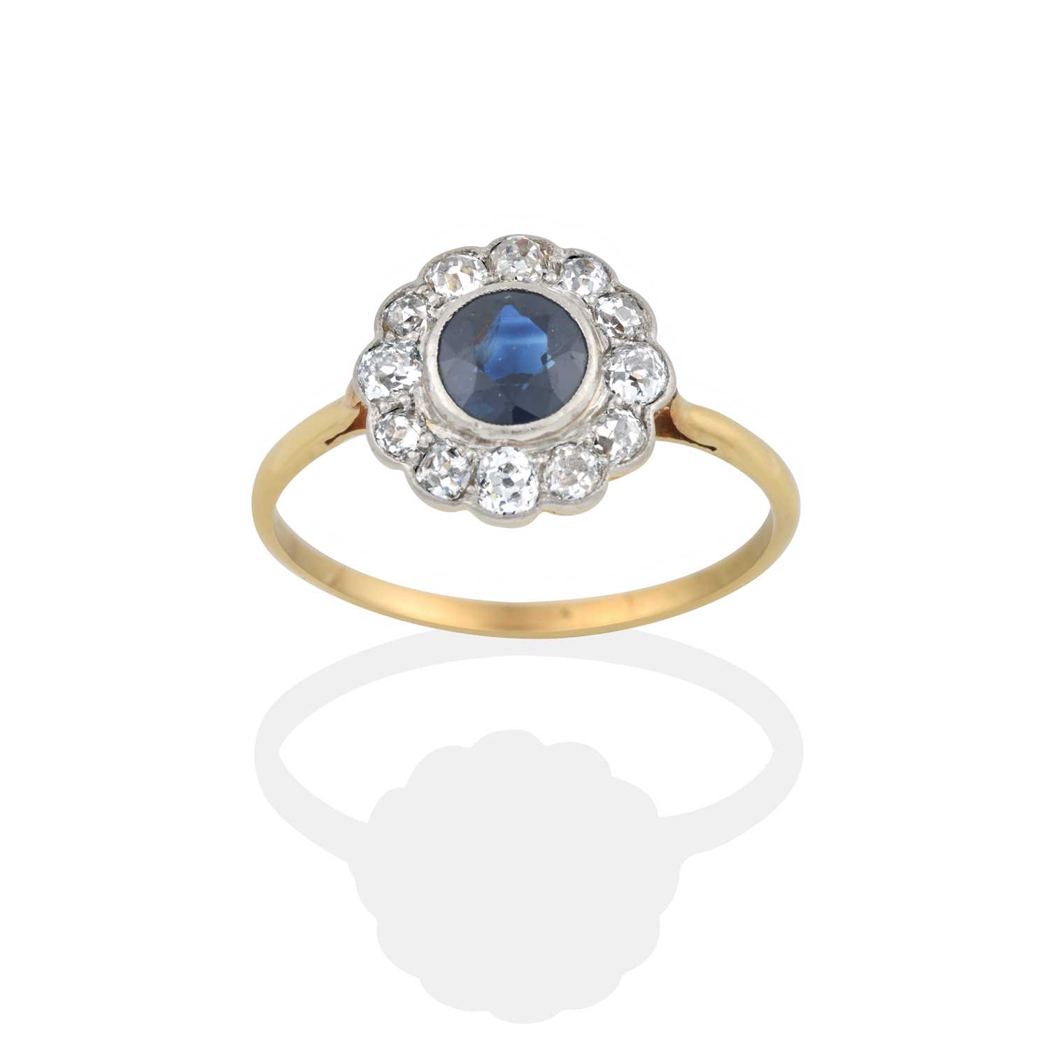 Lot 2401 - A Sapphire and Diamond Cluster Ring