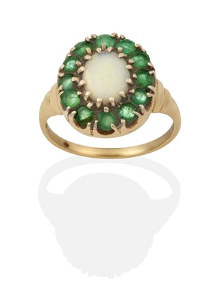 Lot 2347 - An Opal and Emerald Cluster Ring