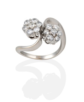 Lot 2354 - An 18 Carat White Gold Diamond Double Cluster Twist Ring