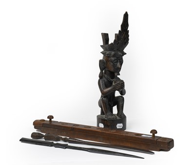 Lot 80 - An African tribal carved hardwood statue of a...