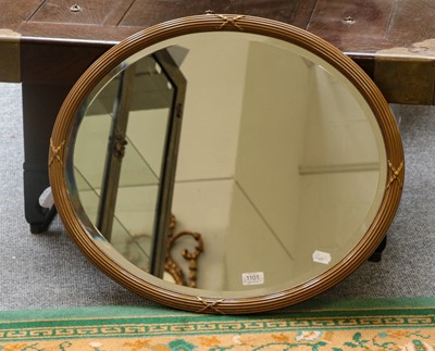 Lot 1101 - A reeded and gilt-framed oval mirror 65cm by 56cm