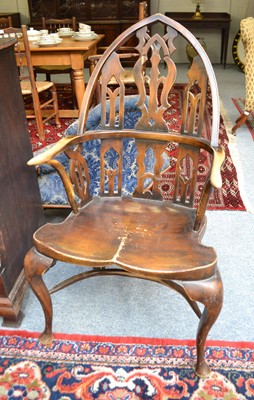 Lot 1077 - A Gothic revival ash and elm Windsor chair,...