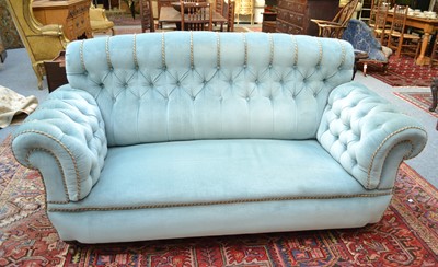 Lot 1076 - A button and blue upholstered sofa