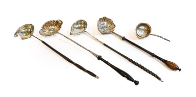 Lot 199 - Four various silver-mounted toddy ladles, two...