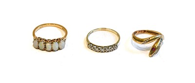 Lot 183 - A 9 carat gold diamond seven stone ring,...