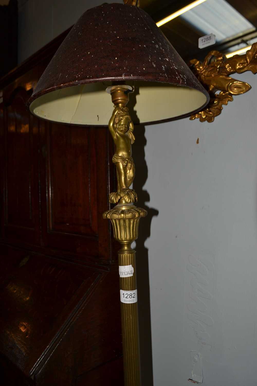 Lot 1282 - A brass standard lamp, the reeded column...