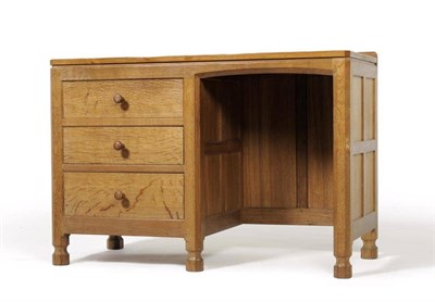 Lot 942 - A Robert  "Mouseman " Thompson Panelled Oak Desk, the rectangular adzed top with raised...