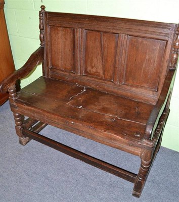 Lot 653 - 18th century and later oak settle