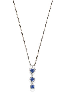 Lot 2406 - An 18 Carat White Gold Sapphire and Diamond Pendant on Chain