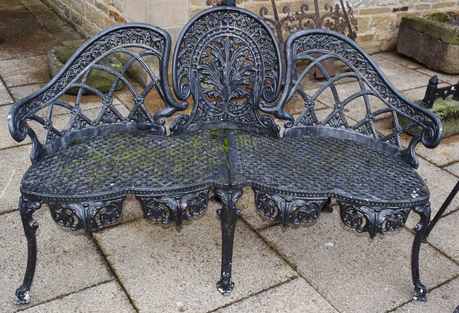 Lot 1301 - A black-painted cast metal hump back garden