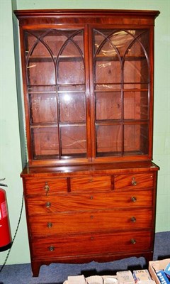 Lot 654 - Regency mahogany six drawer chest with bookcase top