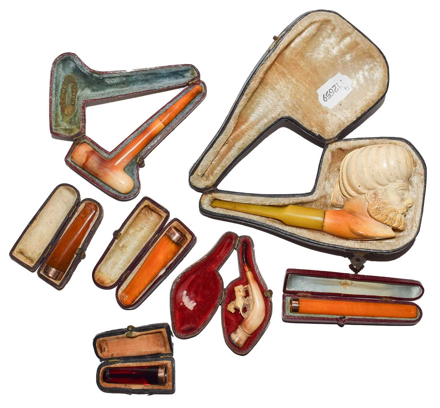 Lot 81 - A collection of pipes, four gold-mounted...