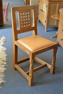 Lot 943 - A Robert  "Mouseman " Thompson Oak Lattice Back Desk Chair, with cow hide upholstered seat, on...