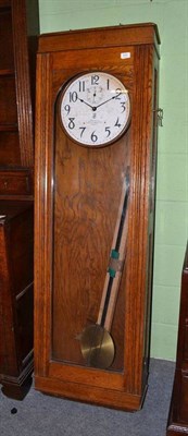 Lot 659 - International time recording clock in an oak case (the master clock from Amblefor college)