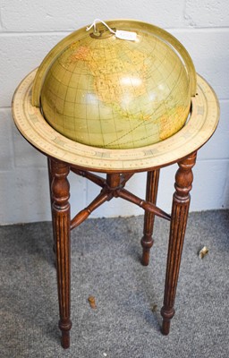 Lot 1295 - A world globe on mahogany stand, label reads...