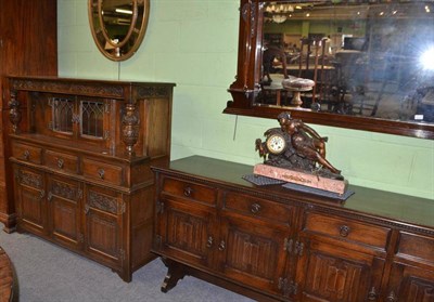 Lot 661 - A reproduction oak court cupboard, a reproduction oak sideboard and an overmantel mirror