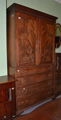 Lot 663 - A George III mahogany linen press with blind fret frieze