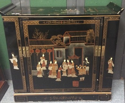 Lot 1101 - A 20th century Japanned cocktail cabinet with...