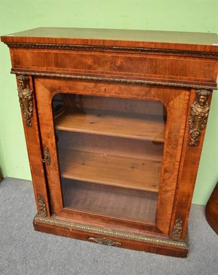 Lot 666 - A Victorian walnut bookcase with gilt metal mounts and a glazed cabinet door