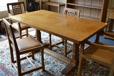 Lot 944 - A Robert  "Mouseman " Thompson Oak 5' Four Plank Refectory Table, on two octagonal legs joined by a