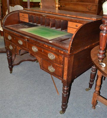 Lot 673 - A 19th century mahogany desk with tambour front