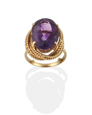 Lot 2378 - An Amethyst Ring and Two Amethyst Pendants on Chains