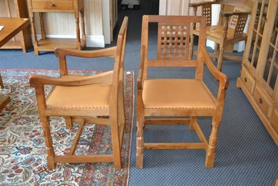 Lot 945 - A Pair of Robert  "Mouseman " Thompson Oak Lattice Back Arm Chairs, with cow hide upholstered...