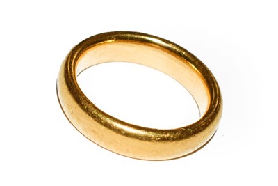 Lot 66 - A 22 carat gold band ring, finger size F