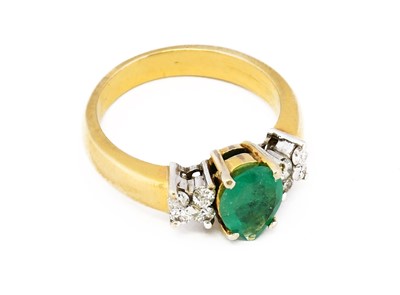 Lot 1056 - An emerald and diamond ring, the pear-shaped...