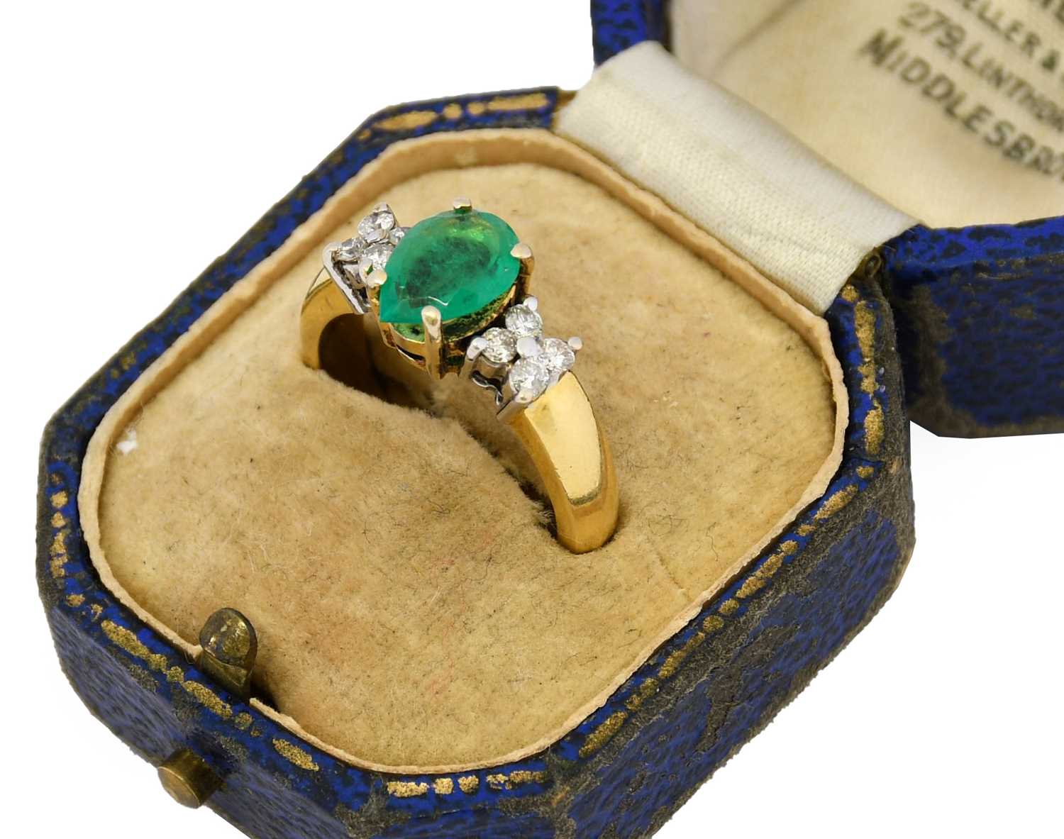 Lot 1056 - An emerald and diamond ring, the pear-shaped...