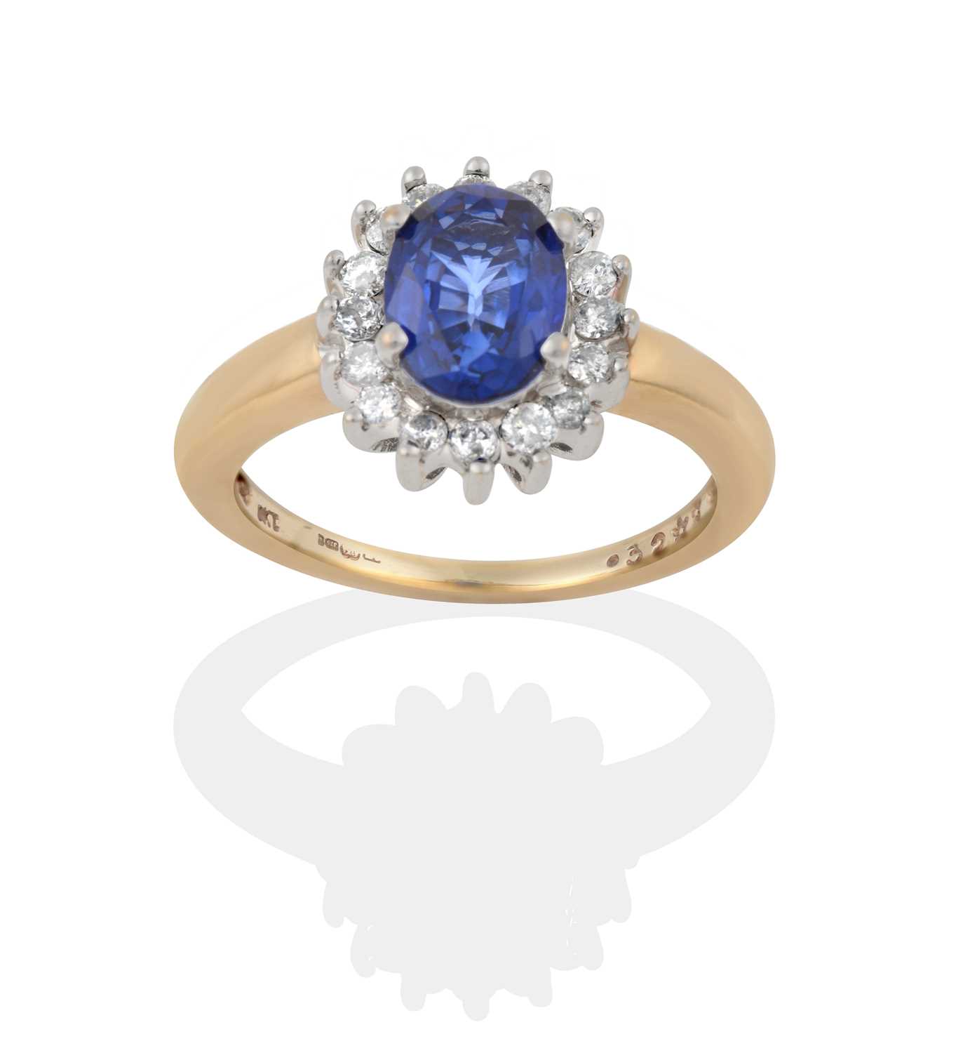 Lot 2407 - A 9 Carat Gold Sapphire and Diamond Cluster Ring