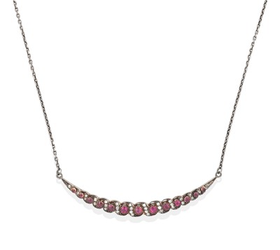 Lot 2272 - A Synthetic Ruby and Diamond Crescent Necklace