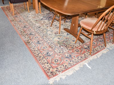 Lot 1301 - A machine made carpet, the cream field of...