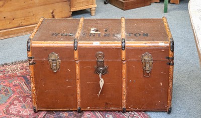 Lot 1135 - A wooden bound travel trunk