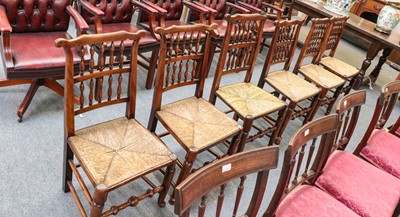 Lot 1237 - A set of six elm and rush seated chairs