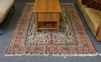 Lot 1015 - Oriental rug, the ivory field of augular vines...