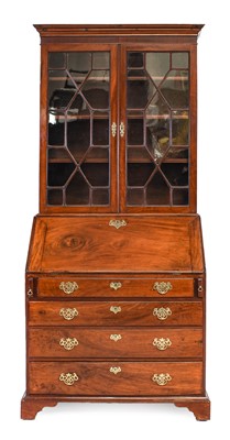 Lot 1313 - A George III mahogany bureau bookcase with...