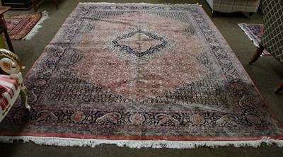 Lot 1112 - An Indian carpet, the candy pink Herati field...
