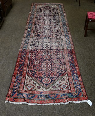 Lot 1014 - A pair of Persian wool runners with foliate...