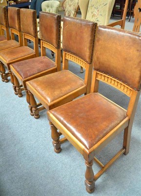 Lot 714 - Set of ten oak dining chairs, with leather upholstery and drop-in seats, labelled Christopher Pratt