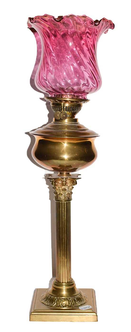 Lot 10 - A Victorian brass Corinthian Column Oil lamp...
