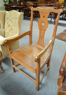 Lot 715 - A Provincial elm armchair with panel seat