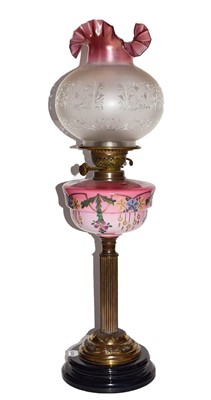 Lot 286 - A Victorian oil lamp with reservoir, decorated...