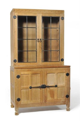 Lot 949 - A Robert  "Mouseman " Thompson Oak Drinks Display Cupboard, the glazed upper section with three...