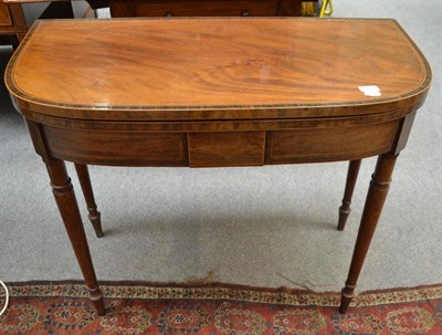 Lot 720 - A 19th century mahogany D-shaped fold-over card table