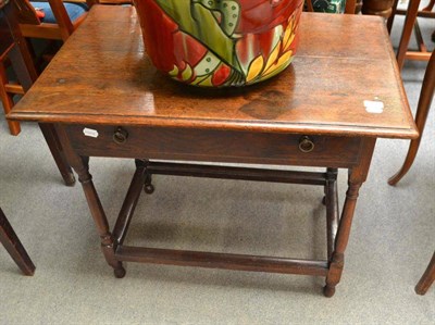 Lot 723 - An 18th century oak side table with frieze drawer