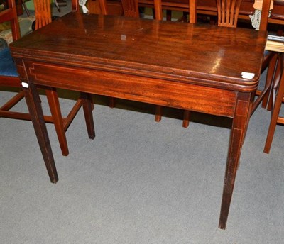 Lot 724 - A 19th century mahogany D-shaped fold-over tea table