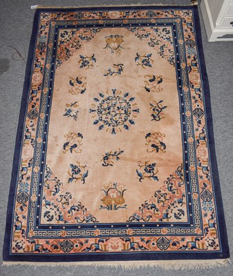 Lot 1001 - A Chinese rug, the ivory field of floral...