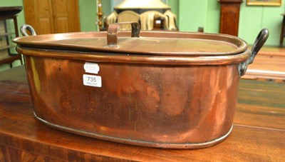 Lot 735 - A copper fish kettle