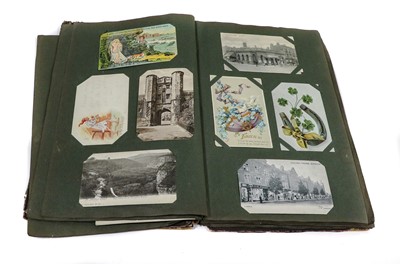 Lot 201 - A Box, containing 2 postcard albums and 2...